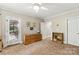 Office with ample storage, filled bookcases, and a doorway to the outdoor patio at 4740 Myers Ln, Harrisburg, NC 28075
