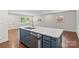 Stylish kitchen island with a sink and modern dishwasher at 4906 Charleston Dr, Charlotte, NC 28212