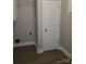 The laundry room features hardwood flooring, neutral paint, and a white cabinet at 518 N Fulton St, Salisbury, NC 28144