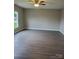 Spacious living room with hardwood flooring, neutral paint, and ample natural light from a large window at 518 N Fulton St, Salisbury, NC 28144