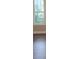 Tall window with views of green trees, light tan paint and hardwood flooring at 518 N Fulton St, Salisbury, NC 28144