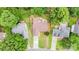 This house has a long driveway, is surrounded by mature trees, and has a well-maintained lawn at 5843 Timber Falls Nw Pl, Concord, NC 28027