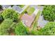 This house has a patio, a well-maintained lawn, a fenced yard, and is surrounded by mature trees at 5843 Timber Falls Nw Pl, Concord, NC 28027