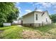A large yard, showcasing lawn, an outbuilding and privacy fencing at 5843 Timber Falls Nw Pl, Concord, NC 28027