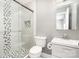 Contemporary bathroom with updated fixtures, glass shower, and hexagon floor at 5843 Timber Falls Nw Pl, Concord, NC 28027