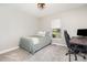 Comfortable bedroom with window and workspace desk at 5843 Timber Falls Nw Pl, Concord, NC 28027