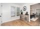 Charming entryway with wainscotting, natural light, and luxury vinyl plank flooring at 5843 Timber Falls Nw Pl, Concord, NC 28027