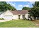 Charming single Gathering home with a well-manicured lawn and two car garage at 5843 Timber Falls Nw Pl, Concord, NC 28027