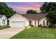 Charming single Gathering home with a well-manicured lawn and two car garage at 5843 Timber Falls Nw Pl, Concord, NC 28027