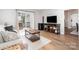 Comfortable living area with backyard access and entertainment center at 5843 Timber Falls Nw Pl, Concord, NC 28027