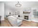 Spacious living room featuring a cozy fireplace, modern decor, and hardwood floors at 5843 Timber Falls Nw Pl, Concord, NC 28027