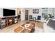 Open-concept living space with wood floors and seating area at 5843 Timber Falls Nw Pl, Concord, NC 28027