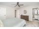 Inviting main bedroom with dresser and en suite bathroom at 5843 Timber Falls Nw Pl, Concord, NC 28027