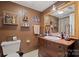 Small bath with a beautiful wood vanity and fixtures, white tile floors, and plenty of storage at 81 21St Nw Ave, Hickory, NC 28601