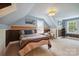 Bright bedroom with unique ceilings, two windows offering natural light, and a comfortable seating area at 81 21St Nw Ave, Hickory, NC 28601
