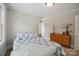 Serene bedroom featuring soft lighting, a large window and a well-placed dresser, exuding a peaceful ambiance at 81 21St Nw Ave, Hickory, NC 28601