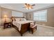 Relaxing bedroom with neutral tones, natural lighting, and a cozy bench at 81 21St Nw Ave, Hickory, NC 28601