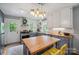 Updated kitchen with gray cabinets, butcher block countertops, and a stylish lighting fixture above the island at 81 21St Nw Ave, Hickory, NC 28601