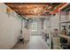 Utility laundry room with white walls, a window, laundry sink, open ceiling, and washer/dryer hookups at 81 21St Nw Ave, Hickory, NC 28601