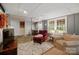 Cozy basement living room featuring neutral tones, comfortable furniture and a large window for natural light at 81 21St Nw Ave, Hickory, NC 28601