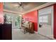 Comfortable living space featuring a red accent wall, natural light, and a piano at 81 21St Nw Ave, Hickory, NC 28601
