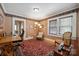 Well-lit office space with patterned rug, two windows, and inviting decor at 81 21St Nw Ave, Hickory, NC 28601