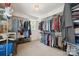 Spacious walk-in closet with metal shelving, hanging clothes, and a window for natural light at 81 21St Nw Ave, Hickory, NC 28601