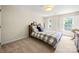 Bedroom with neutral walls, ceiling fan, and nice windows at 8500 Headford Rd, Charlotte, NC 28277