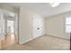 Neutral bedroom featuring plush carpet, a double door closet, and an inviting, airy feel at 8500 Headford Rd, Charlotte, NC 28277