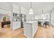 Spacious kitchen with island, stainless steel appliances, and an adjacent breakfast area and dining room at 8500 Headford Rd, Charlotte, NC 28277