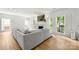 Bright living room featuring hardwood floors, fireplace and large windows at 8500 Headford Rd, Charlotte, NC 28277