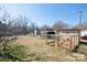 Large backyard with shed and chicken coop on a sunny day at 101 Sunset Dr, Stanley, NC 28164