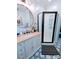 Modern bathroom with black shower, gold mirror, and black and white patterned floor at 101 Sunset Dr, Stanley, NC 28164