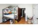 room with a unique bed frame, hardwood floors and natural light at 101 Sunset Dr, Stanley, NC 28164