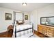 Cozy bedroom with hardwood floors, neutral walls, and traditional furnishings at 101 Sunset Dr, Stanley, NC 28164