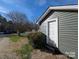 Side view of an updated home with green siding at 101 Sunset Dr, Stanley, NC 28164