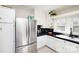 Spacious kitchen with stainless steel refrigerator and white cabinets at 101 Sunset Dr, Stanley, NC 28164
