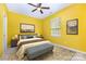 Cozy bedroom features carpet floors, ceiling fan, and a neutral decor with plenty of natural light at 10105 Community House Rd, Charlotte, NC 28277