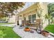 Inviting front porch with decorative plants, stone accents and a cozy entryway to this house at 10105 Community House Rd, Charlotte, NC 28277