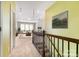 Inviting hallway leads to a living area with plush seating and bright natural light from large windows at 10105 Community House Rd, Charlotte, NC 28277