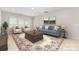 Comfortable living room featuring a plush sofa, armchairs, a decorative rug, and ample natural light at 10105 Community House Rd, Charlotte, NC 28277