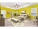 Sunlit main bedroom features a tray ceiling, work space, and large windows with privacy blinds at 10105 Community House Rd, Charlotte, NC 28277