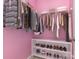 Bright walk-in closet with hanging rods for clothes and shelving units for shoe storage, creating an organized space at 10105 Community House Rd, Charlotte, NC 28277