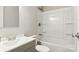 Bright bathroom featuring a white vanity and a shower over tub with white shower surround at 1016 S D Ave, Maiden, NC 28650