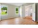Bright bedroom with two windows offering pleasant views and light gray walls, with wood-look flooring at 1016 S D Ave, Maiden, NC 28650
