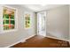 Bedroom with light gray walls and carpet and two windows that provide natural light and views at 1016 S D Ave, Maiden, NC 28650