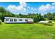 Home exterior featuring well-maintained lawn and outdoor covered parking at 1016 S D Ave, Maiden, NC 28650