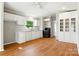 Modern kitchen with hardwood floors, white cabinetry, and modern appliances at 1016 S D Ave, Maiden, NC 28650