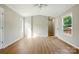 Bright living room with hardwood flooring, two windows, and neutral paint colors at 1016 S D Ave, Maiden, NC 28650