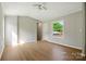 Spacious living room with neutral paint, ceiling fan, and hardwood flooring at 1016 S D Ave, Maiden, NC 28650